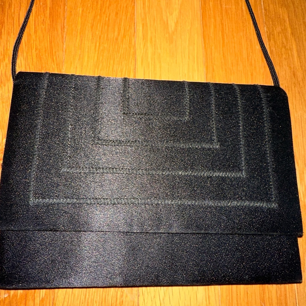 Vintage Whiting and Davis black satin evening bag. Pocket inside. Used once.